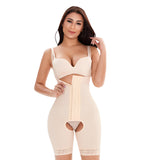 Woman wearing a beige shapewear garment on a light gray background