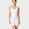 Woman wearing a white bodysuit against a plain background