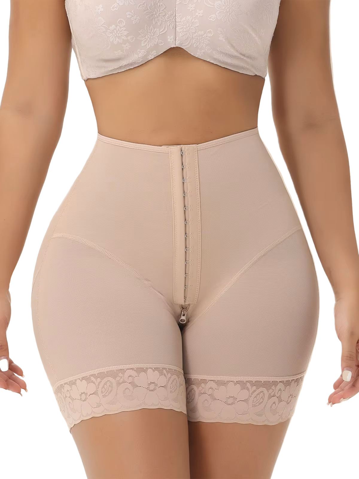 Beige shapewear with lace trim worn by a person on a beige background