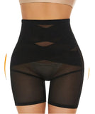 Black shapewear shorts on a beige background