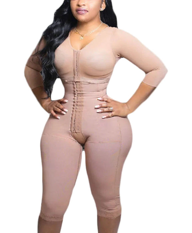 Woman wearing a beige shapewear jumpsuit on a white background