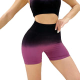 Person wearing black and purple gradient shorts on a light gray background