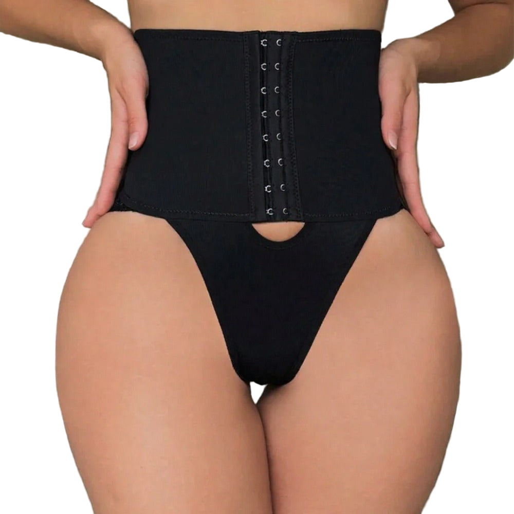 Person wearing a black waist trainer in a room setting.