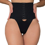 Person wearing a black waist trainer in a room setting.