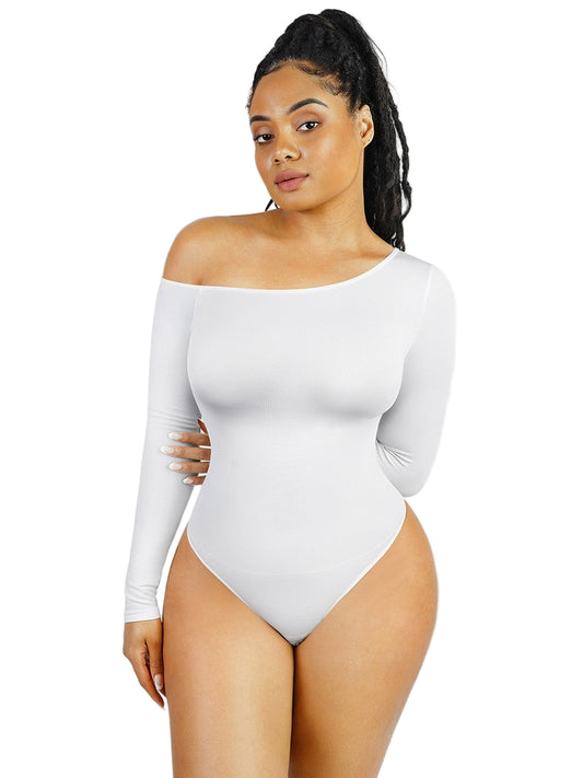 Woman wearing a white off-shoulder bodysuit against a light gray background