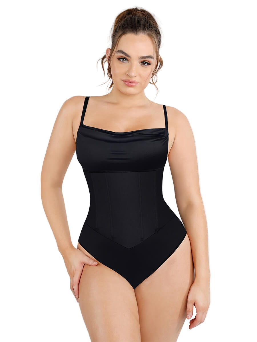 Woman wearing a black swimsuit against a white background