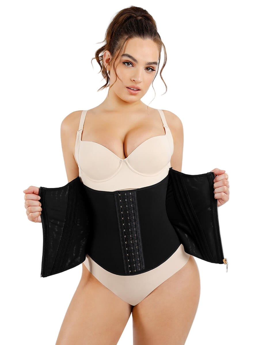 Woman wearing a black waist trainer with beige top and underwear on a white background