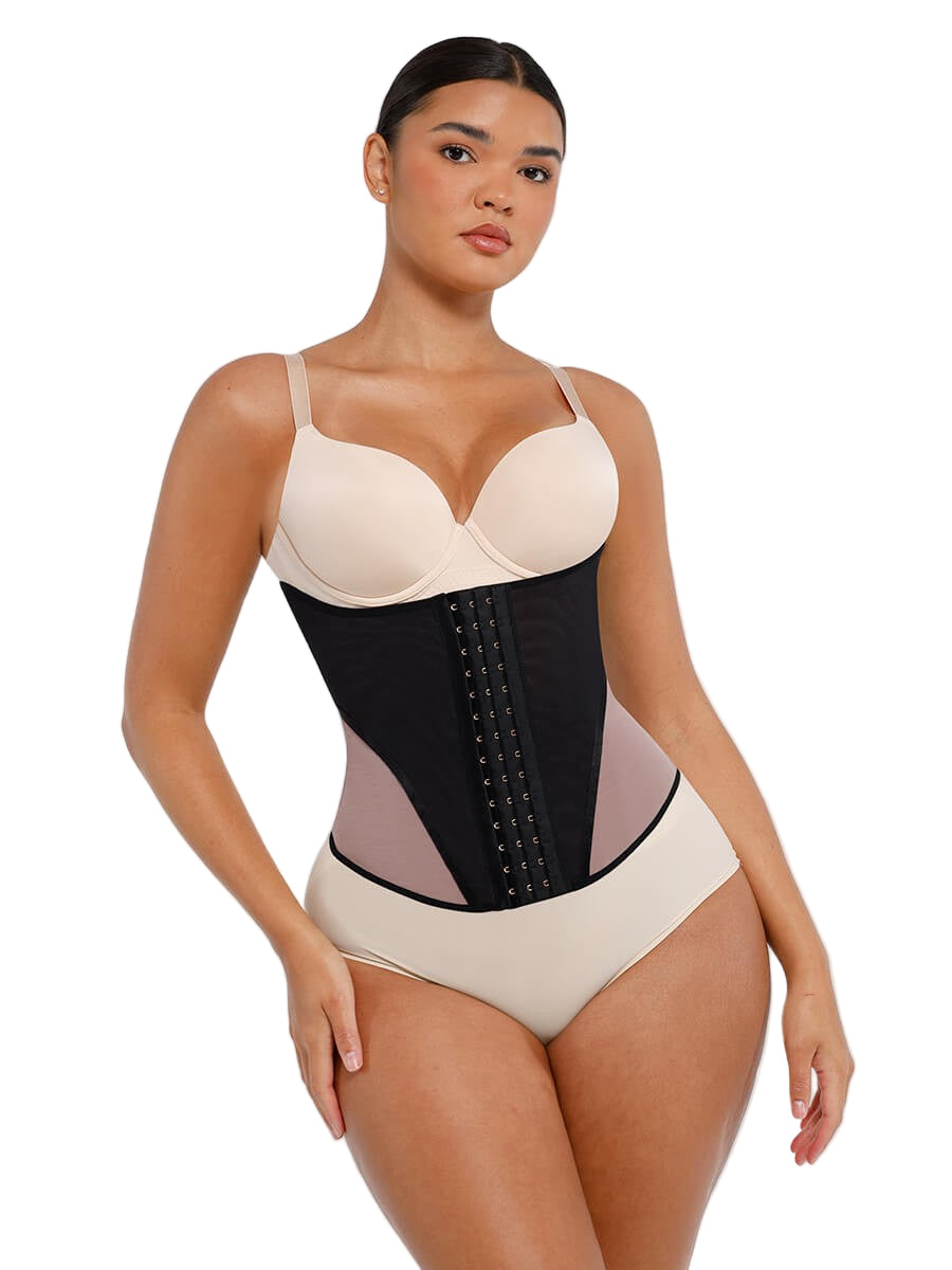 Woman wearing a beige and black waist trainer on a white background