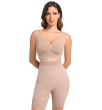 Woman wearing a beige shapewear set on a white background