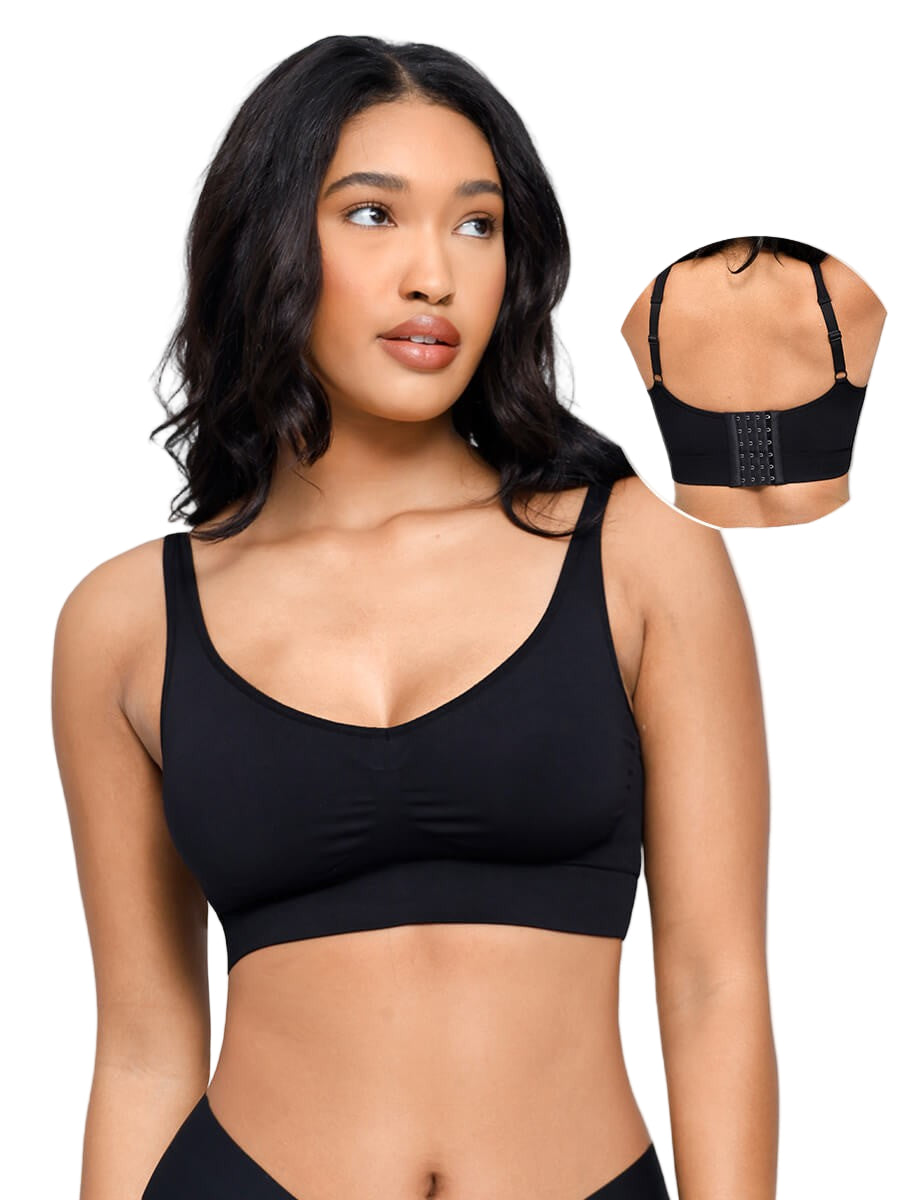 Woman wearing a black sports bra with an inset showing a close-up of the bra.