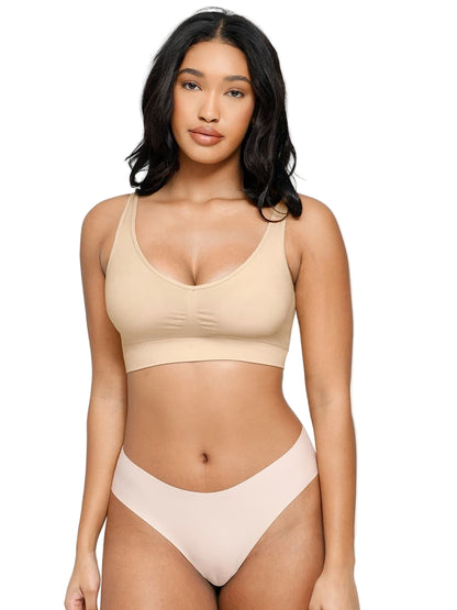 Woman wearing a beige bikini set on a white background
