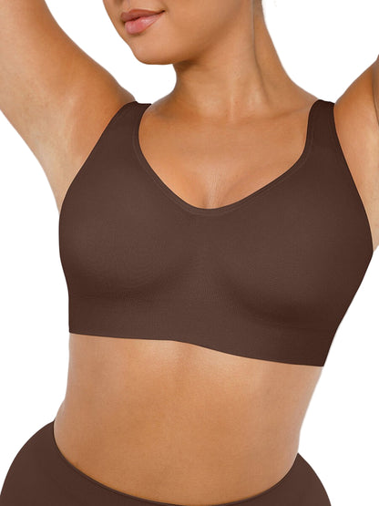 Brown sports bra worn by a person on a plain background
