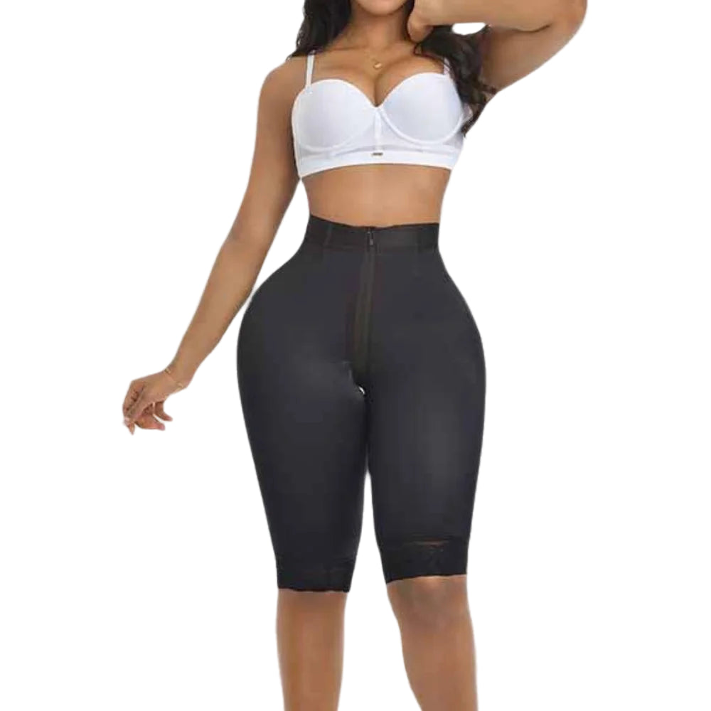 Person wearing a black shapewear garment on a plain background