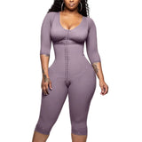 Person wearing a purple jumpsuit against a plain background