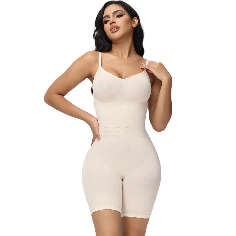 A woman wearing a black seamless tummy control bodysuit with a white underwire bra.