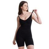 Woman wearing a black shapewear garment on a light purple background