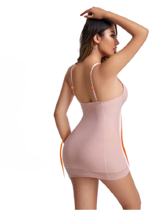 Woman wearing a beige shapewear dress with adjustable straps on a pink background