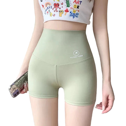 Person wearing green shorts with a visible brand logo, standing against a neutral background.