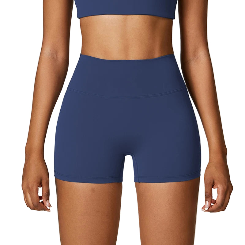 Person wearing blue athletic shorts on a plain background