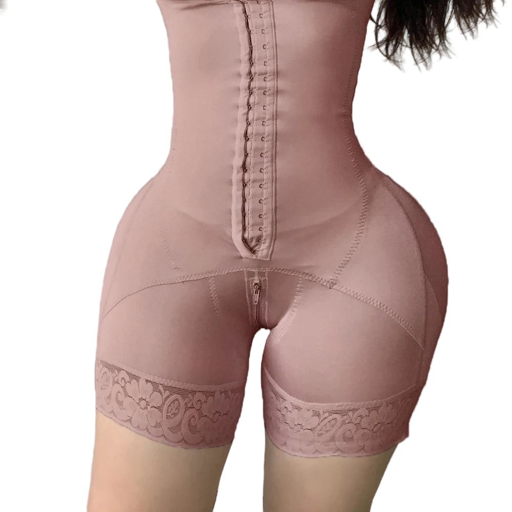 A pair of high-waisted white butt lifter shaping shorts with a decorative lace trim and front zipper closure, designed for tummy control and waistline enhancement.