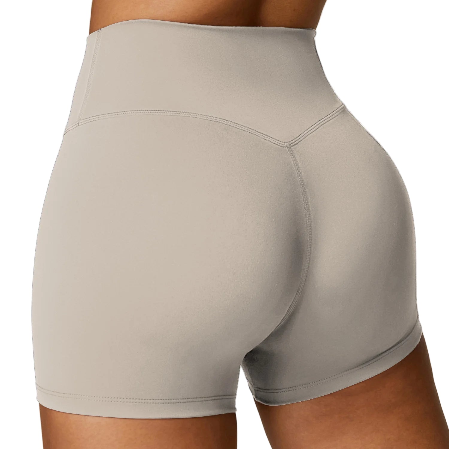 Beige athletic shorts worn by a person on a plain background