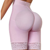 Pink leggings with lace trim worn by a person, standing on a staircase.