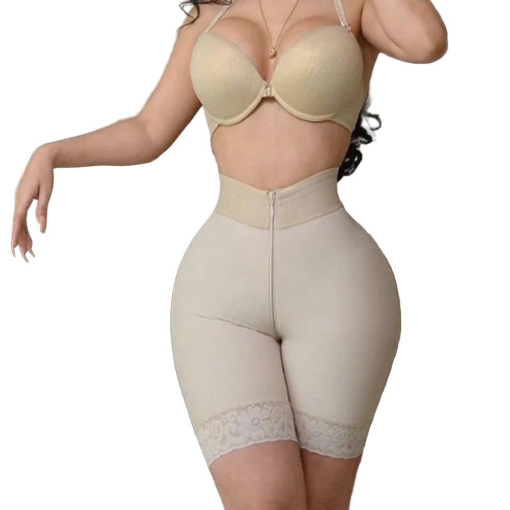 Person wearing a beige shapewear garment in an indoor setting.
