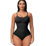 Woman wearing a black bodysuit against a white background