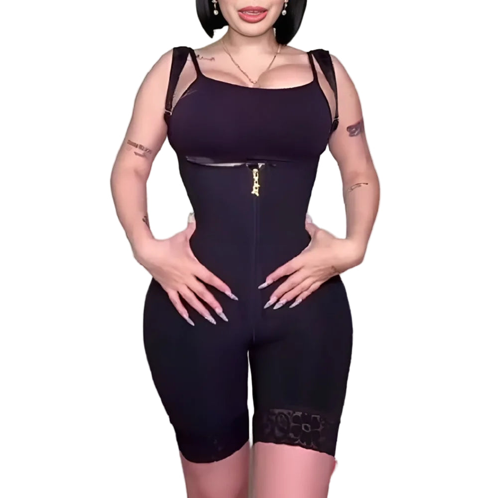 Person wearing a black bodysuit with sheer panels against a plain background