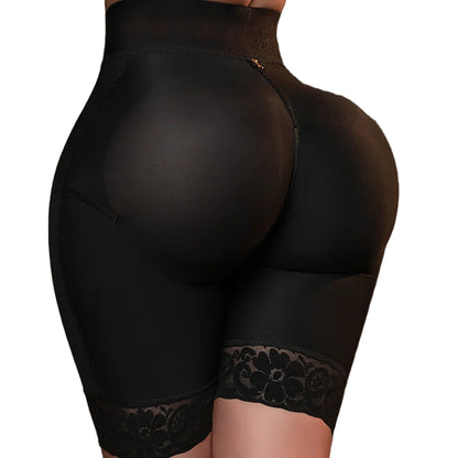 Black shapewear with lace trim on a brown background