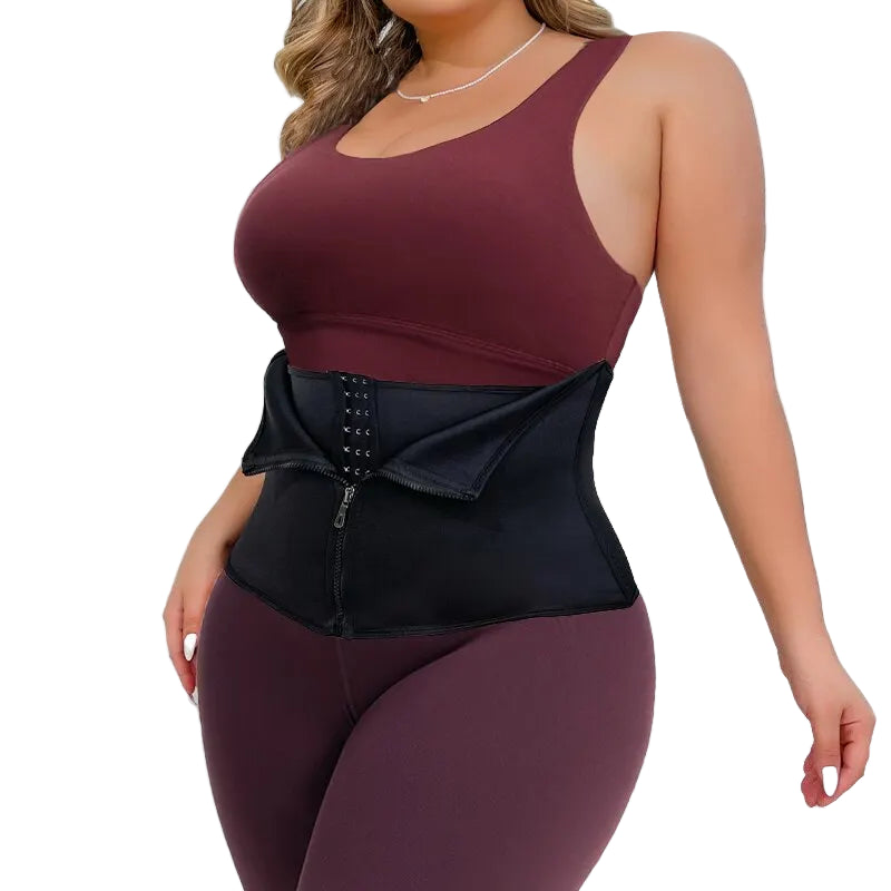 Woman wearing a black waist trainer with maroon top and pants on a white background