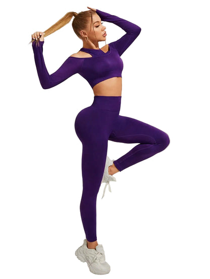 Person wearing a purple athletic outfit posing against a neutral background