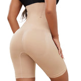 Beige shapewear shorts worn by a person on a white background