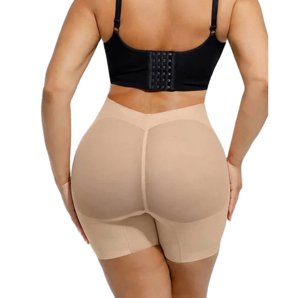 Beige shapewear shorts worn by a person on a white background