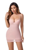 Woman wearing a pink shapewear dress with text highlighting features on a pink background