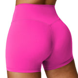 Pink athletic shorts worn by a person on a plain background
