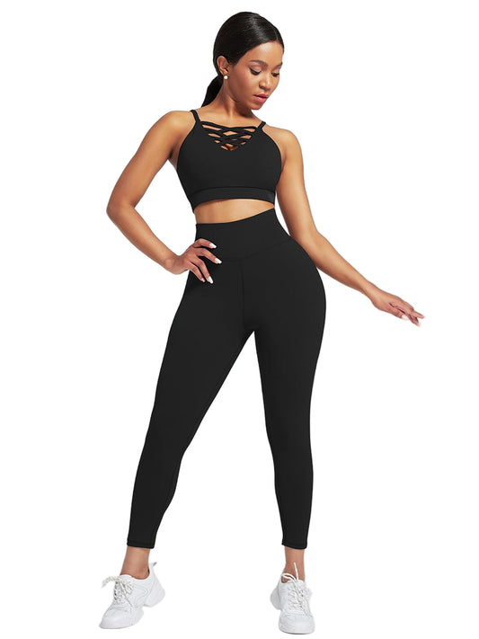 Woman wearing a black sports bra and leggings set on a white background