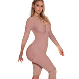 Woman wearing a pink bodysuit against a soft, neutral background